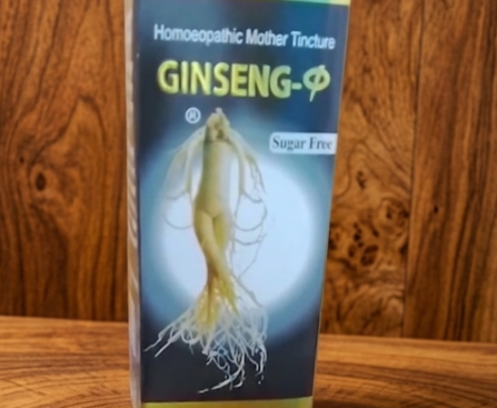 Front of a homeopathic Ginseng tincture box with ginseng root illustration on a wooden surface, includes a Sugar Free label and UNISON branding at the bottom